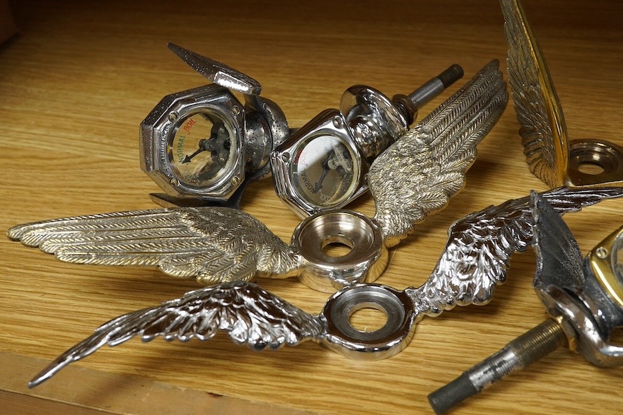 Four car mascot Calormeters by Wilmot-Breeden, three examples with winged bases, together with three additional winged bases, two radiator caps, a brass bonnet mounting, and other related fittings. Condition - fair to go